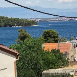 GRAĐEVINSKO ZEMLJIŠTE S PRISTUPNIM PUTEM I POGLEDOM NA MORE - KALI, UGLJAN nekretnina za prodaju